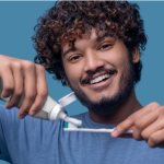healthy smile maintained through proper dental implant cleaning