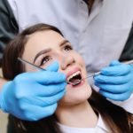 woman undergoing dental treatment for dentures